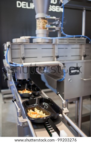 COLOGNE, GERMANY - MARCH 27 : New dosing machine SD for trend food on display at the Leonhardt booth at the ANUGA FoodTec industry trade show in Cologne, Germany on March 27, 2012.