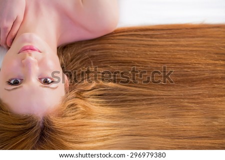 Young beautiful woman with long hair on white background