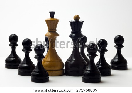 Chess white king and black queen with the few black pawns on a white background