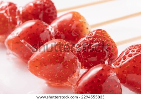 Similar – Image, Stock Photo A fresh strawberry skewered with a fork