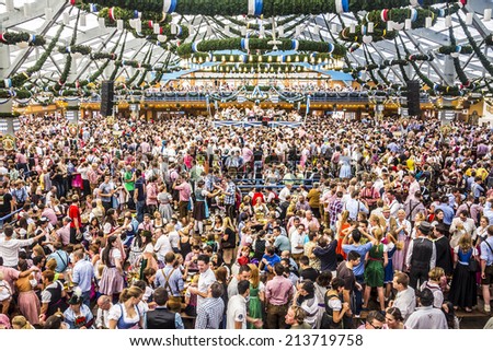 MUNICH, GERMANY - SEPTEMBER 23, 2012: Oktoberfest, Munich: Overview over the big beer tent. In the background is the band.
