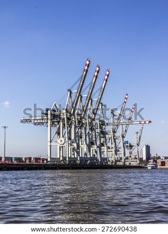 HAMBURG, GERMANY - APRIL 19, 2015: A container terminal in the harbor of hamburg, Germany. A ship lies not more than one day in the terminal.