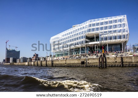 HAMBURG, GERMANY - APRIL 19, 2015: The Unilever house and the Marco Polo Building are part of the hafencity at the bank of river Elbe in Hamburg, Germany. In the background is the Elbphilharmonie.