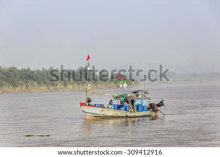 DAWEI, MYANMAR - FEBRUARY 16, 2015: Fishermen are working on board of their ship at Dawei in the south of Myanmar.