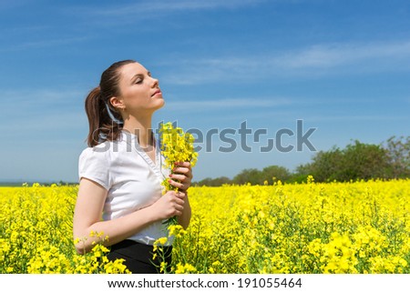 business woman with yellow flowers on the field