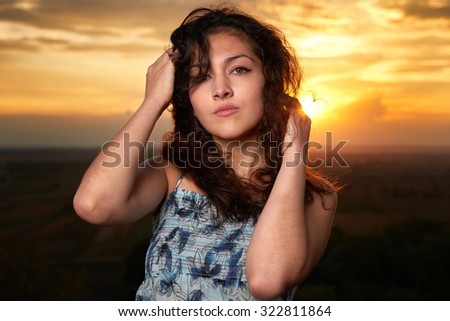 girl portrait at sunset on plain background