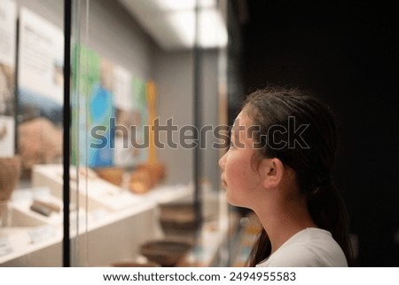 Similar – Image, Stock Photo Curious female on vacation travelling by coastal train