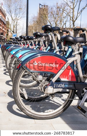 London, UK - April 12 2015: Detail of Boris bikes in line.  On 27 February 2015, Mayor Boris Johnson announces Santander as new Cycle Hire sponsor which will replace Barclays bank.