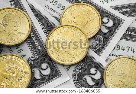 two dollar bills and one dollar coins