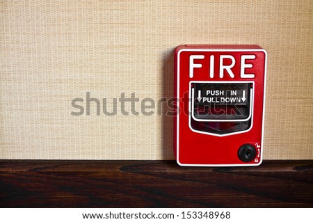 Many buildings have manual fire alarm boxes. There is room for your copy on the left side.