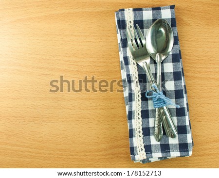 Silverware or flatware set of fork and spoon on wooden table