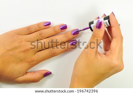 Manicure nail paint purple color