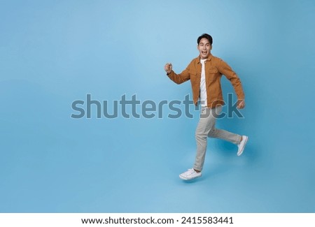 Similar – Image, Stock Photo Handsome young man jumping against grey wall