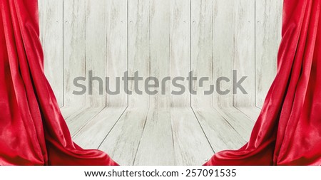 Open red curtains on a wood stage background.