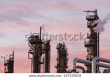 Close up view of oil refinery piping and towers