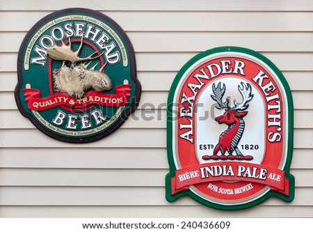 EASTERN PASSAGE, CANADA - DEC 28, 2014: Beer signs on wall. Moosehead is a Canadian independent brewery based in Saint John, NB. Alexander Keith\'s is a Canadian brewery founded in 1820 in Halifax, NS.
