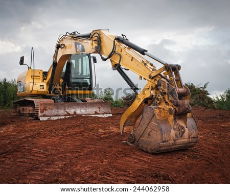 WENTWORTH, CANADA - SEPTEMBER 02, 2014: Caterpillar excavator on site. Caterpillar is the world\'s leading producer of construction equipment including engines,turbines and diesel-electric locomotives.