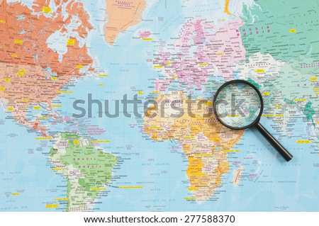 PLEASANT VALLEY, CANADA - MAY 12, 2015: Route Master World map and magnifying glass highlighting the Middle East Region. Route Master is a Canadian map company doing business across North America.