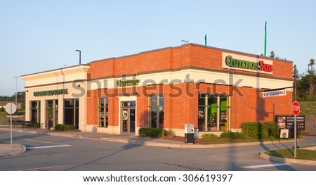 DARTMOUTH, CANADA -AUGUST 16, 2015: Quiznos is a fast-food restaurant brand specializing in toasted submarine sandwiches. Starbucks is the largest coffeehouse company in the world.