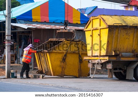 Similar – Image, Stock Photo moving yellow dumpster in front of a red brick wall