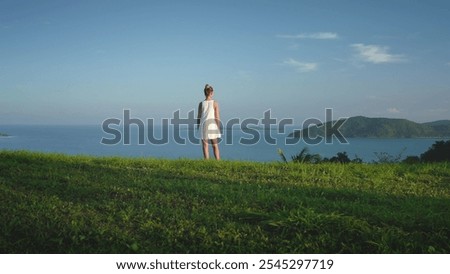 Similar – Image, Stock Photo Female relaxing on cliff and admiring picturesque view