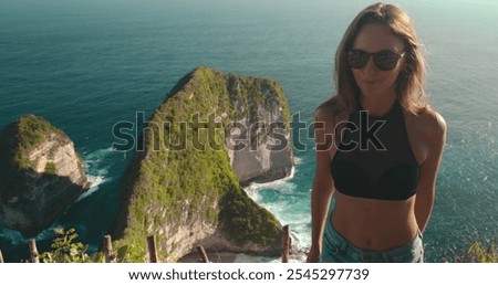 Similar – Image, Stock Photo Coastal landscape and girl in yellow hooded coat looking at sea and walking. Copy space.