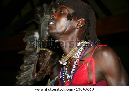 Warrior from a Masai tribe in the Masai Mara reserve in Kenya in a tribal dance