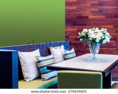 Modern dining room   interior design with seat and artificial flower vase