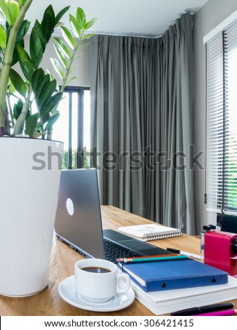 Interior design of modern working table with laptop computer at home office