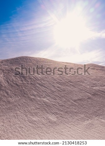 Arid sand dune landscape with bright sunbeams illuminating the surface texture Foto stock © 