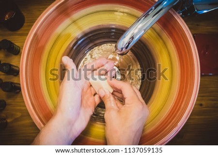 Similar – Image, Stock Photo Flatlay of woman rubbing cream in her legs in bed