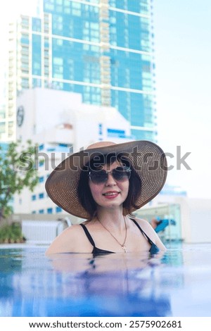 Similar – Image, Stock Photo Woman in hat standing on beach and enjoying seascape
