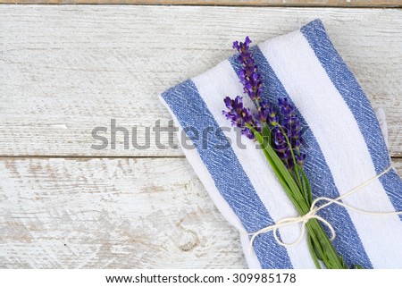 white grey old white wooden shelves background with empty copy space and lavender flowers and blue napkin towel decoration