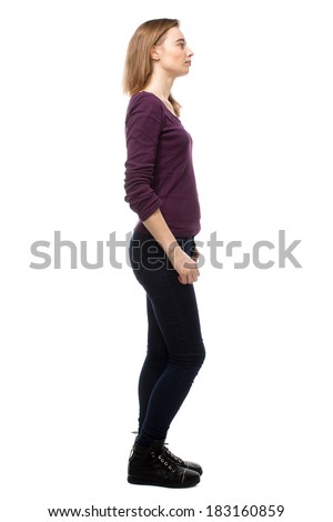 Thoughtful Slender Young Woman In Casual Clothes Standing Sideways ...