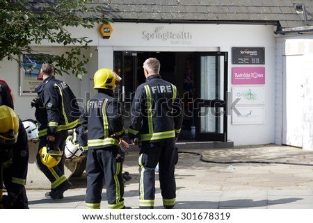 Belsize Park, London, UK, 31st July, 2015. Firemen looking at the scene of the fire which was extinguished
