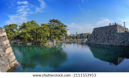 Scenery of the Moat of Takamatsu Castle ruins seen in the blue sky background at Kagawa pref.