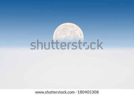 Full Moon rising behind the Earth\'s atmosphere - eclipse\' effect from atmospheric refraction.