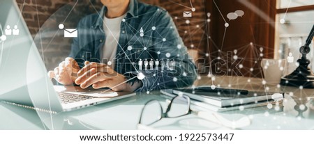 Close-up photo of male hands with laptop. Man working remotely at home. Concept of networking or remote work. Global business network.