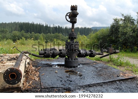 Similar – Image, Stock Photo Old dilapidated fuel pump for liquid fuel in detail with reflection of a blue oh so environmentally friendly xyz car