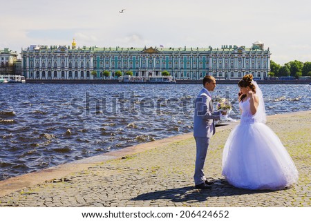 ST PETERSBURG, RUSSIA-JUNE 14. Arrow of Vasilevsky island opposite the Winter Palace in St. Petersburg June 14, 2014. Favorite place for wedding photo shoot