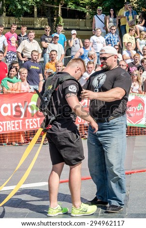 Lviv, Ukraine - July 2015: Yarych street Fest 2015. The World's Strongest Man Vasyl Virastuk referee strongmen competitions