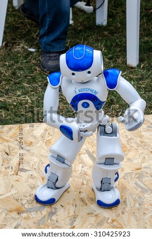 Lviv, Ukraine - August 2015: The robot Noosphe managed by the operator remotely via computer