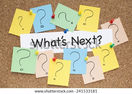 What is Next Concept , with colorful question marks on corkboard