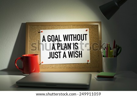 A Goal Without A Plan Is Just A Wish / Motivational Business Phrase On Bulletin Board in Office