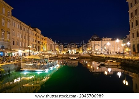 Canal Grande di Trieste at night with beautiful buildigs and refletion on the water . Foto stock © 