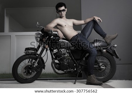 Asian shirtless male model with vintage motorbike