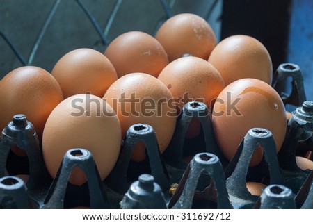 raw eggs in black package in the kitchen restaurant