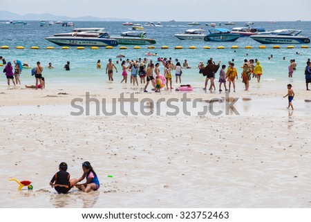 PATTAYA ,AUGUST 30 : Tourists are swimming in the sea of Koh Larn Island beach in Pattaya City on August 30,2015, Koh Larn island is the most famous of pattaya city in Pattaya Chonburi, Thailand.