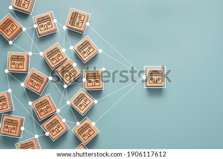 Business sale growth and expand shop franchise concept, Store illustration print screen on wooden cube block connection link with others shop and supermarket. 商業照片 © 