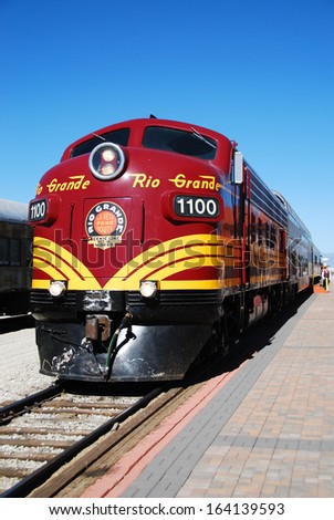 ALAMOSA, CO, USA - JUNE 6: A diesel-powered locomotive waits for departure at the Alamosa station on June 6, 2013 in Alamosa, Colorado. This scenic train rides to Monte Vista from June to August.